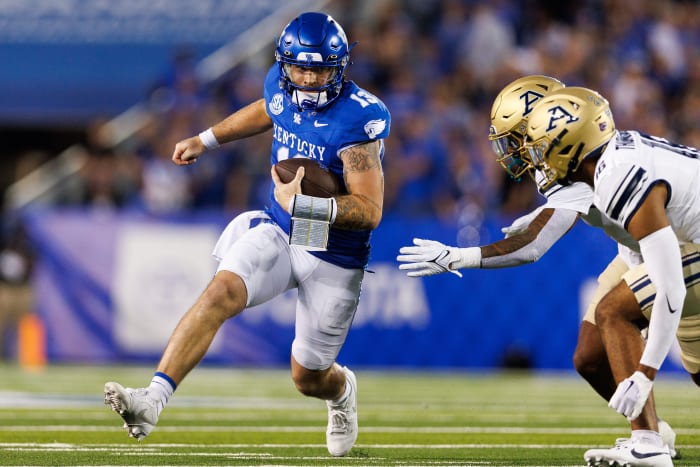 Sep 16, 2023; Lexington, Kentucky, USA; Kentucky Wildcats quarterback Devin Leary (13) carries the ball during the first quarter against the Akron Zips at Kroger Field. Mandatory Credit: Jordan Prather-USA TODAY Sports
